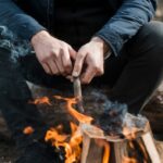 Fire Starting: The Ignition Protocol close-up-man-taking-care-bonfire_23-2148506911